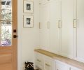 Fully enclosed custom cabinets in the mudroom keep the view from the kitchen tidy.