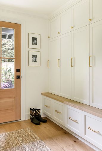Fully enclosed custom cabinets in the mudroom keep the view from the kitchen tidy.