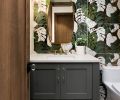 Powder bath’s oversized Tropez Foliage Blanco tile inspired many showgoers. Capital Lighting sconce from Globe Lighting teams with brass-trimmed Uttermost mirror and Brizo plumbing. Fresh Concrete Caesarstone countertop crowns cabinet in Succulent Sherwin Williams.