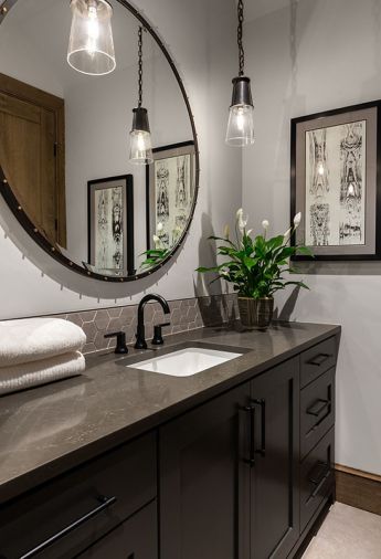 Upper Bonus Room bath Ceasarstone Peitra Gray countertop, Bedrosians Materika hex backsplash. Globe Lighting pendants face Tiffany Home Design mirror. Drift of Mist wallcolor.