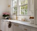 The windows by Stile Windows & Doors, from Windows, Doors & More, are consistent with the original windows in this remodeled Dutch Colonial home. Brass Waterworks sconces and a California Faucets, both from Chown Hardware, sync with cabinet hardware from Rejuvenation.