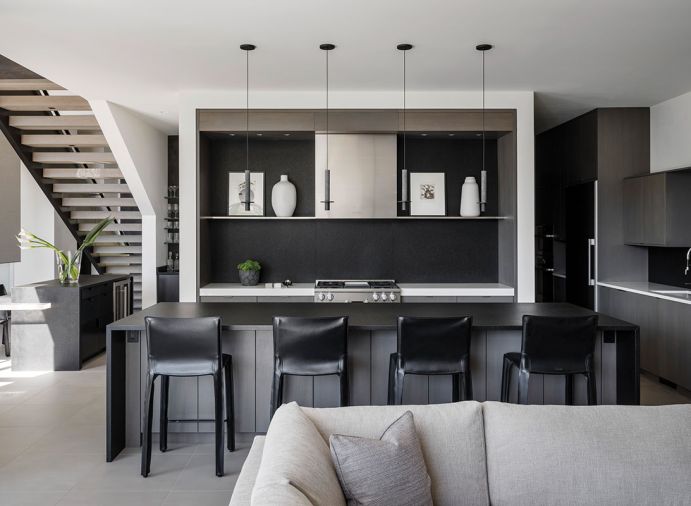 David Pompa pendants. Walker Zanger Zimbabwe Black Absolute granite island and backsplash. Custom kitchen cabinetry by Urban Cabinets.