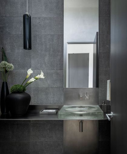 Powder room Heritage Madeira Limestone from Architectural Surfaces. Articolo lighting. John Lewis glass sink.