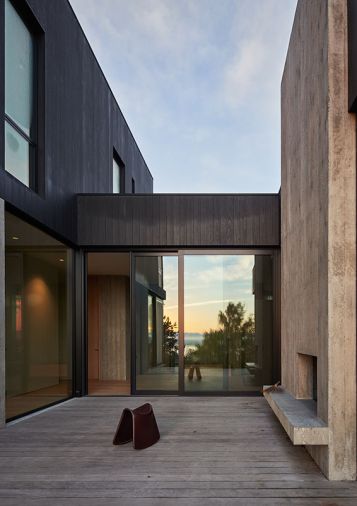 High-efficiency windows and sliders from Dynamic Fenestration are central to the daylighting plan and the structure’s passive cooling aspects. The home is diffused with natural light throughout the day. The window placement both frames and obscures to achieve the most aesthetic outdoor views.