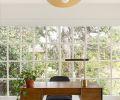 Wise Design, Sasquatch Architecture, and Soren Clark of Owen Gabbert, LLC overhauled this 1922 Alameda Ridge house in Portland from top to bottom. In the office, an original window was preserved and joined with a mid-century desk, upholstered dining chair, and Olivia Pendant, all from West Elm.