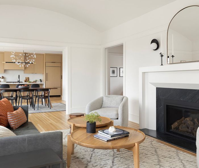 “Annie is really good at designing toward what works best in a home, whether it’s traditional or modern, or both,” says Celtnieks. Living room furnishings were sourced from West Elm, Rejuvenation, and Burke Decor, with Pearl sconces from Cedar and Moss.