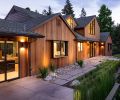 Schouten’s transformed exterior features vertical cedar fine line T&G siding from Lakeside Lumber. Handsome Michael Schultz Landscape Design draws eye to newly designed roof, windows, and dramatic entry illuminated by Oregon Outdoor Lighting.