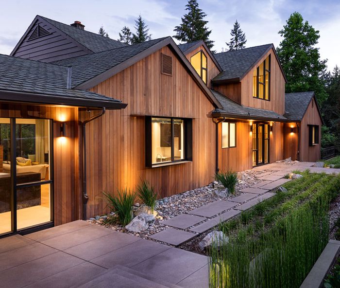 Schouten’s transformed exterior features vertical cedar fine line T&G siding from Lakeside Lumber. Handsome Michael Schultz Landscape Design draws eye to newly designed roof, windows, and dramatic entry illuminated by Oregon Outdoor Lighting.