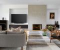 Roche Bobois artwork draws eye to newly crafted fireplace with concrete trowel finish by Bravura Finishes. Driscoll Robbins and YERRA rug (both pages) from SMG Collective.