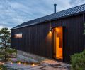 The boat house exterior is clad with Nakamoto Forestry’s Suyaki shou sugi ban siding, which is charred cypress shiplap from Japan, selected for its resistance to rot, fire and insects.