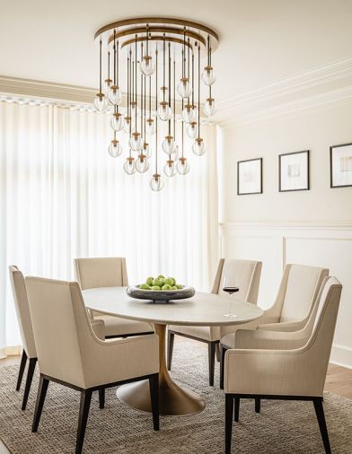 Restoration Hardware Pearl Round chandelier, Aero marble oval table, Leigh dining chairs.