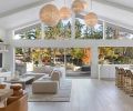 Vanillawood reorganized the layout of this Lake Oswego bungalow so all of the main living spaces now benefit from a rear wall of glass with views of the lake. The wood floors were sourced through Contract Furnishings Mart.