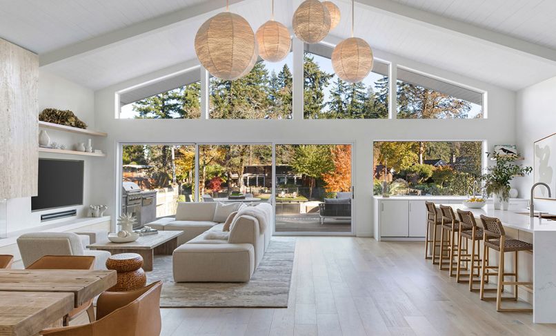 Vanillawood reorganized the layout of this Lake Oswego bungalow so all of the main living spaces now benefit from a rear wall of glass with views of the lake. The wood floors were sourced through Contract Furnishings Mart.