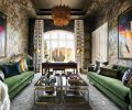 Step into a room where furnishings, textures, colors and Scalamandre wallpaper evoke conversation. Velvet Sunpan sofas pair with Sonder Living coffee tables, plush Lexmark carpet, and Stacey Garcia custom drapes. Arteriors Prescott 2-tiered chandelier lights artwork from Left Bank.