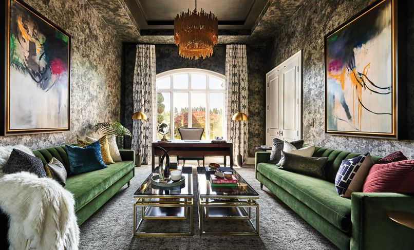 Step into a room where furnishings, textures, colors and Scalamandre wallpaper evoke conversation. Velvet Sunpan sofas pair with Sonder Living coffee tables, plush Lexmark carpet, and Stacey Garcia custom drapes. Arteriors Prescott 2-tiered chandelier lights artwork from Left Bank.