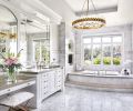 Bravura Finishes white textural glass studded ceiling. Kohler plumbing from Keller Supply. Arteriors Haskell Large Chandelier.