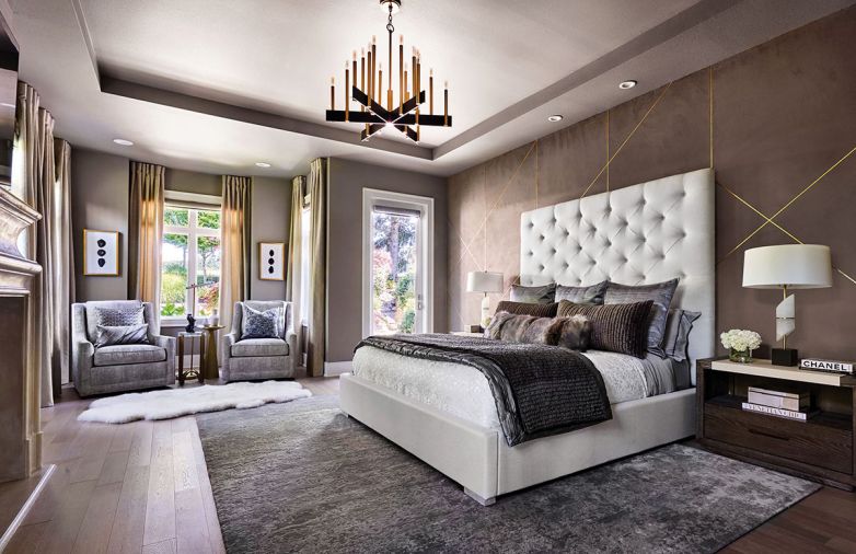 Bravura Finishes gold-trimmed wall. Abrams Chandelier by Hudson Valley Lighting.