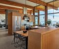 In the kitchen, a Perfect Cool French Door Refrigerator and 36  Pro-style Duel-Fuel range, both Miele, from DeWaard & Bode. Wood paneling and cabinetry by K&S Woodworks.