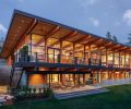 Ground Face CMU Block, laid in a stacked bond pattern from Bouwman Masonry, forms retaining walls and covers exterior portions of the house to protect it from harsh weather. The Sierra Pacific windows and doors clad over VG Fir from Island Sash and Door Inc.