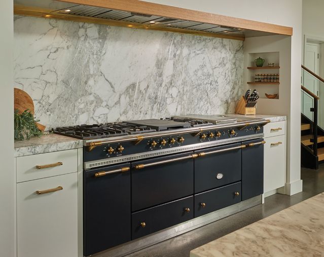 Calacatta Viola marble backsplash, natural stone slab. Lacanche Sully 2200 Classique gas range.