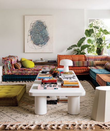 Mah Jong Sofa by Roche Bobois. Custom Waka Waka coffee table. Art by Sue Danielson.