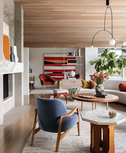 Burnt Orange Mohair Salon Slipper chairs by Orange Furniture. Front Facing Art by Ken Kelly. Calacatta Machia Vecchia marble mantel from Waterworks.