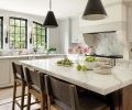 Meticulous craftsmanship and materials transform the kitchen of this 1978 home into something worthy of its heritage. Flush inset cabinets, marble countertops, and brass hardware from Schaub + Company embody an ageless style.