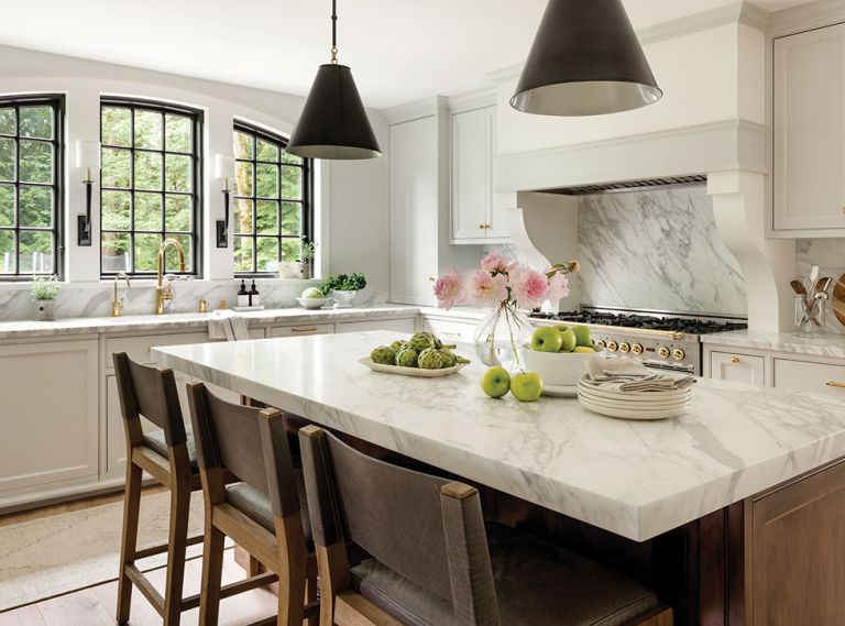 Meticulous craftsmanship and materials transform the kitchen of this 1978 home into something worthy of its heritage. Flush inset cabinets, marble countertops, and brass hardware from Schaub + Company embody an ageless style.