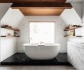 For Clients That Wanted to bring elements from their favorite spas home, Suzanne Scott first seamlessly clad this bathroom in wood and marble. Concealed storage and camouflaged HVAC vents, sleek reveals in the trim, and even a window that has a remote-controlled “fogger” for on-demand privacy, finishes the ultimate no-stress retreat, with polished nickel plumbing fixtures for sparkle.