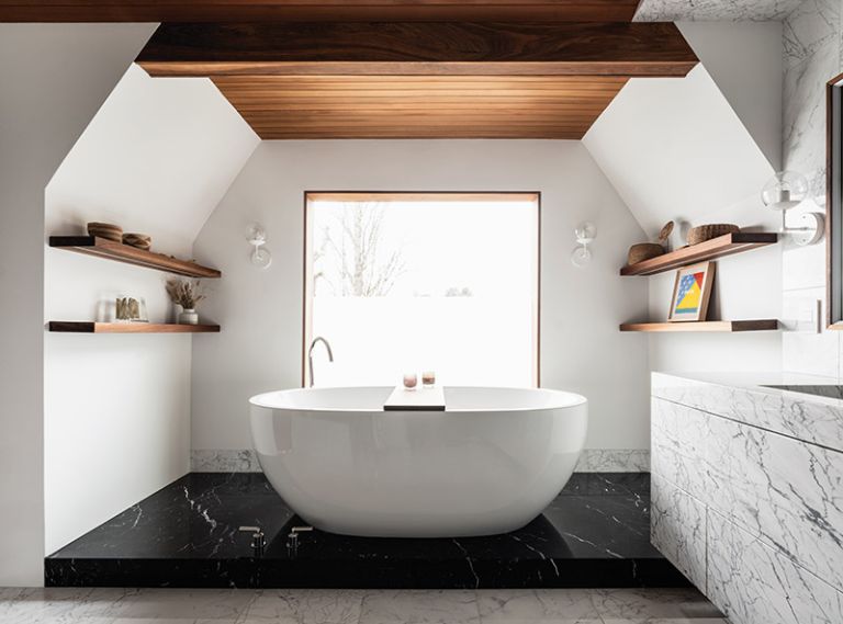 For Clients That Wanted to bring elements from their favorite spas home, Suzanne Scott first seamlessly clad this bathroom in wood and marble. Concealed storage and camouflaged HVAC vents, sleek reveals in the trim, and even a window that has a remote-controlled “fogger” for on-demand privacy, finishes the ultimate no-stress retreat, with polished nickel plumbing fixtures for sparkle.