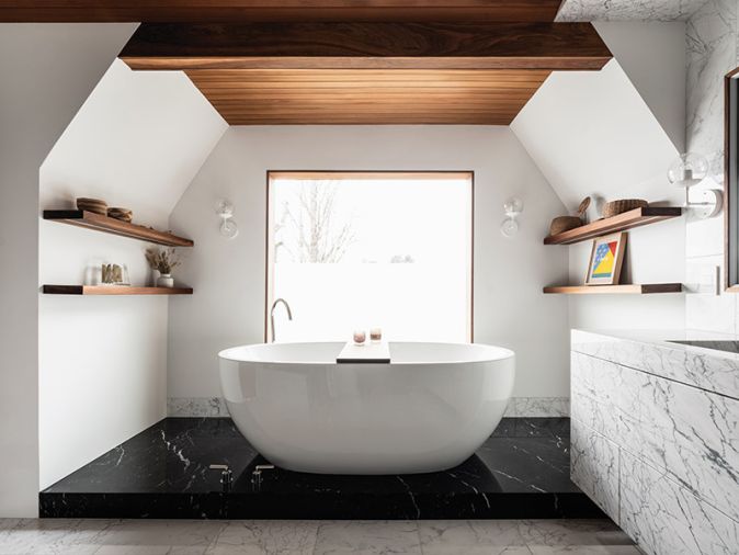 For Clients That Wanted to bring elements from their favorite spas home, Suzanne Scott first seamlessly clad this bathroom in wood and marble. Concealed storage and camouflaged HVAC vents, sleek reveals in the trim, and even a window that has a remote-controlled “fogger” for on-demand privacy, finishes the ultimate no-stress retreat, with polished nickel plumbing fixtures for sparkle.
