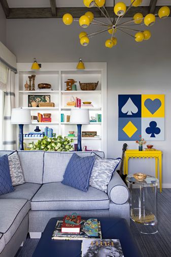 Cheerful yellow chandelier from Jasper Showroom. Custom tables, lighting, and furniture by Massucco Warner.