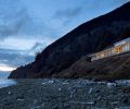 Lit amidst the crepuscular sky, the angular modern home architects chadbourne + doss designed is artfully tucked into the steep hillside, where “it becomes a beacon against the forest’s green,” says Doss.
Photo by Jeremy Bittermann/JBSA