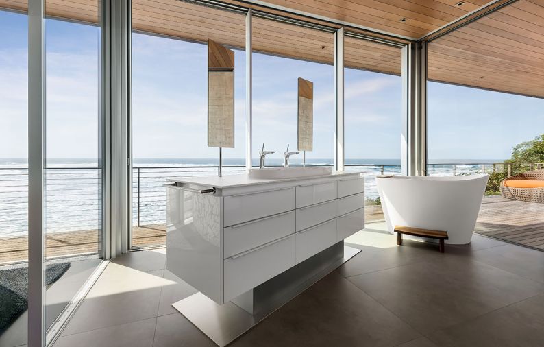 The floating vanity by Pacific Design boasts “nFusion” glass fronts and countertop from Stone Center, Inc. WS Bath counter-mount mirrors appear to float above sinks.
Photo by Justin Krug