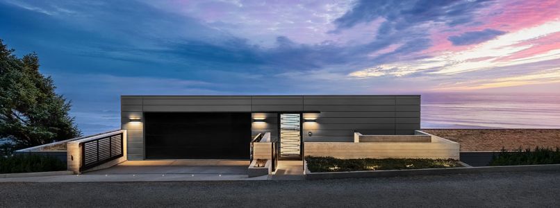 Framing a custom entry door by Modern Steel Doors, is VMZINC, Zinc, and board-formed concrete siding from Shamrock Metal Systems. Outdoor lighting by Oregon Outdoor Lighting.
Photo by Justin Krug