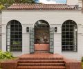 Steel windows and doors from 1995 remodel restored by Lockhart-Suver link to original c. 1930s metal doors aligning with Steel-Arte window and door series by Dynamic Fenestration elsewhere. Landscape design by Cambium Landscape.