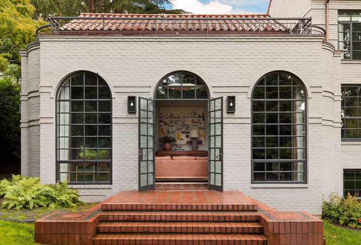 Steel windows and doors from 1995 remodel restored by Lockhart-Suver link to original c. 1930s metal doors aligning with Steel-Arte window and door series by Dynamic Fenestration elsewhere. Landscape design by Cambium Landscape.