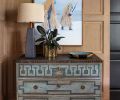 Neo-Classical chest grounds Charles Freger photo against elegant white oak paneling by Hoedemaker Pfeiffer.