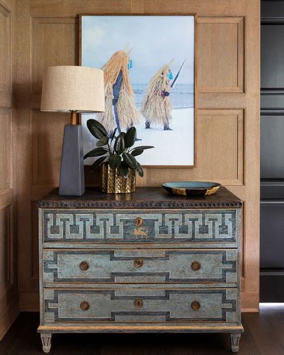 Neo-Classical chest grounds Charles Freger photo against elegant white oak paneling by Hoedemaker Pfeiffer.