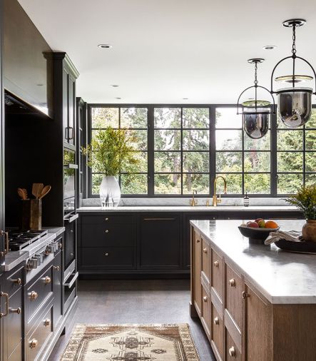 Handsome Northwest Custom Cabinetry ties to Albert Lee Appliances. Urban Electric pendants echo Steel-Arte windows by Dynamic Fenestration. Watermark plumbing and hardware from Hardware International provide the final touches.