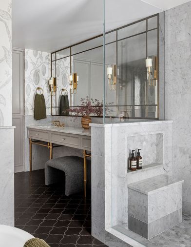 Hoedemaker Pfeiffer custom mirror with integrated lighting and medicine cabinets. Pacific Shapes lantern black flooring from Cement Tile Shop. Northwest Custom Cabinetry with brass legs.