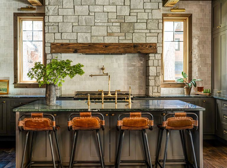 The kitchen is a focal point in Sherri and Ali Anissipour’s Suncadia home, with custom cabinetry by United Cabinetry, a weathered white zellige tile backsplash, soapstone counters, and a custom range surround by designer Jessica Nelson and WoodRidge Custom Homes.