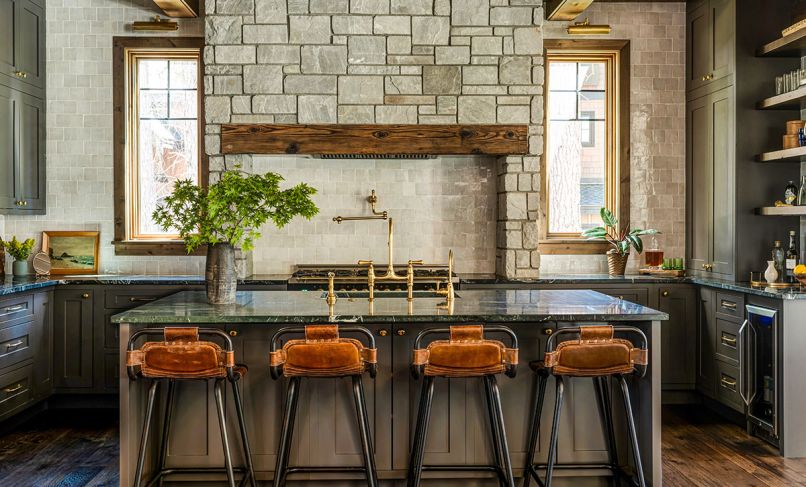 The kitchen is a focal point in Sherri and Ali Anissipour’s Suncadia home, with custom cabinetry by United Cabinetry, a weathered white zellige tile backsplash, soapstone counters, and a custom range surround by designer Jessica Nelson and WoodRidge Custom Homes.