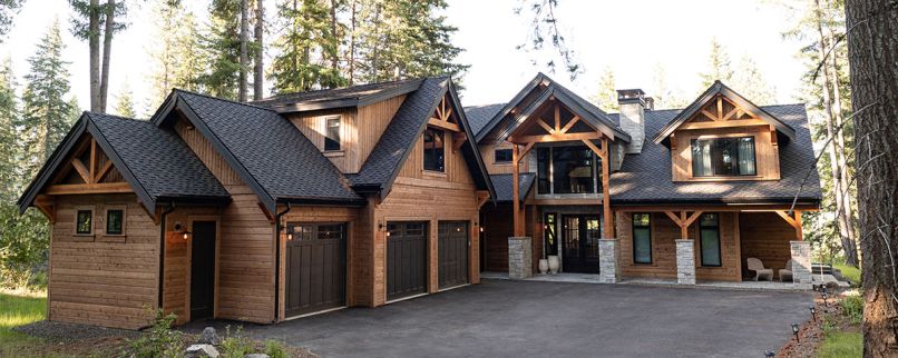 On the exterior, the elegant Pabco comp roofing is from Peak Construction, joined with knotty cedar siding from Wine Valley Siding Supply. A custom front door was added to the home from Old World Door, with Emtek hardware. Handsome triple Northwest Door garage doors provided by Gale Construction.
