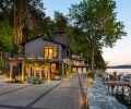 This 6,880-square-foot Bremerton home was remodeled in 2023. The architects redesigned the driveway with Park Permeare in pewter with charcoal accents from Western Interlock Inc. to give it more character. Exterior lighting provided by Northwest Outdoor Lighting.