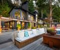 Kolbe Windows and Doors from Classic Window Products are joined by Kuro Shou Sugi Ban siding, Cypress Charred from ReSawn Timber. Custom driftwood and steel bench by Jane Friedman, the Loll Adirondack Lounge Chairs are from DWR.