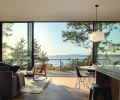 The most stunning feature of this modern home is the wall of Fleetwood sliding glass doors from Cherry Creek Windows & Doors, providing an unfettered view of the Salish Sea.