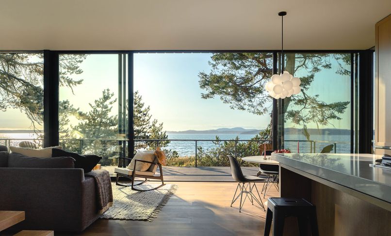 The most stunning feature of this modern home is the wall of Fleetwood sliding glass doors from Cherry Creek Windows & Doors, providing an unfettered view of the Salish Sea.