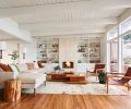 Serenity envelopes the newly opened living room with comfy Lee Industries sofa, vintage leather chairs and two juxtaposed Room and Board coffee tables. Christiane Millinger rug reiterates the feel of Midcentury travertine fireplace and shelves.