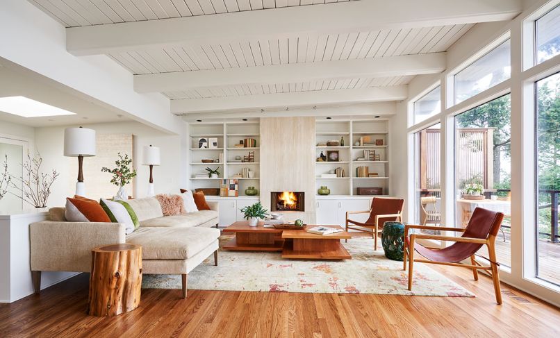 Serenity envelopes the newly opened living room with comfy Lee Industries sofa, vintage leather chairs and two juxtaposed Room and Board coffee tables. Christiane Millinger rug reiterates the feel of Midcentury travertine fireplace and shelves.